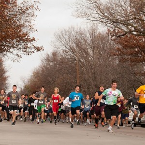Participants in the 2011 Howard Hustle Two-Mile Run/Walk start the race during the Thanksgiving Weekend tradition at Hesston College.
