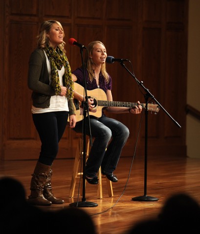 Freshman Carley Wyse (Archbold, Ohio) and sophomore Rachel Miller (Hutchinson, Kan.) perform a song during the Thanksgiving Talent Show.