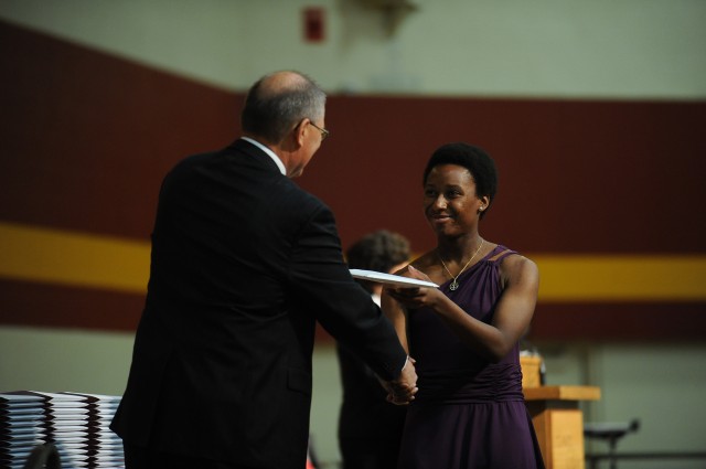 Destavia Davis, Nacogdoches, Texas, receives her Hesston College diploma from President Howard Keim.