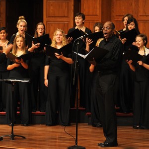 Hesston College sociology instructor and artist in residence Tony Brown joins the Hesston College Bel Canto Singers, under the direction of Bradley Kauffman, for a song during the college’s Opening Celebration service Aug. 16.