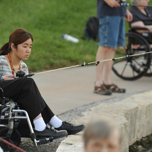 Misaki Murakami ’15 (Osaka, Japan) fishes with Schowalter Villa resident Allen Bitikofer Ac38 at Lake Vista as part of Service Week.
