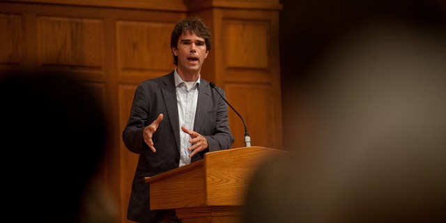 Warren St. John, author of “Outcasts United” shares his experiences and realizations in researching the book during a presentation at Hesston College Sept. 19. “Outcasts United” is the college’s campus-wide common read for 2013-14 in their study of migration and transformation.