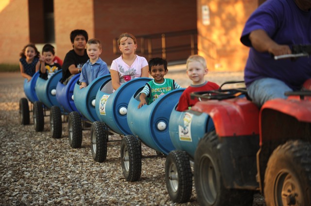 Children enjoy a barrel train ride around campus at the Friday night Family Festival. Alumni, faculty, staff, students and local families came out for the event that included children’s activities, a barbecue picnic and Larks athletic events. 