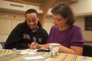 Sonia Nazario, author of "Enrique's Journey" signs a copy of the book for Hesston College freshman Christian Stevens of South Bend, Ind.