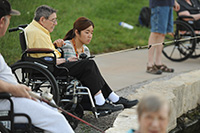 Misaki Murakami ’15 (Osaka, Japan) fishes with Schowalter Villa resident Allen Bitikofer Ac38 at Lake Vista as part of Service Week. 