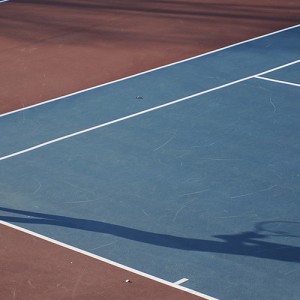 Hesston College women's tennis action photo