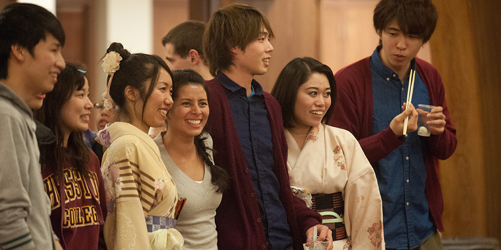 Hesston College students Sho Ishihara, Ayaka Senoo, Narumi Hayano, Danika Saucedo Salas, Shikou Morishita, Misaki Hirayama and Kento Ueda merge their cultures during the college’s annual Cultures Fair Feb. 20. International students shared their customs, culture, music and food with the campus community during the celebration.