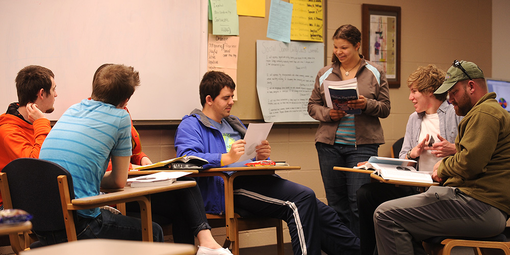 A group of Hesston College students discusses concepts in their Positive Psychology class.