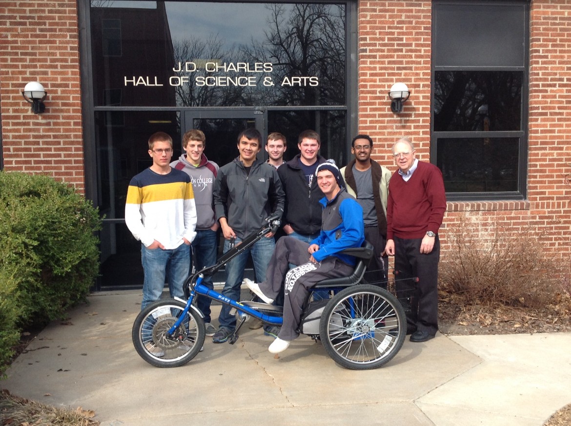 Hesston College Physics II students display the solar powered personal activities vehicle they built as a class project during the spring 2014 semester.