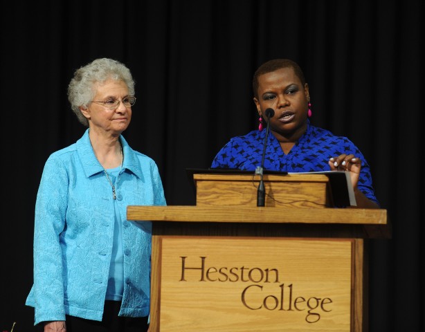 Hesston College natural science faculty member Marelby Mosquera (right) and nursing faculty member Joyce Huber (left) deliver a joint-address encouraging graduates to carry Hesston College values with them throughout life at commencement exercises May 11.