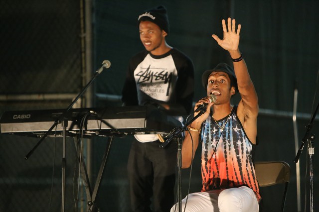 Aaron Young, a 2012 graduate, performs as AY MusiK on the entertainment stage during a late night coffeehouse.