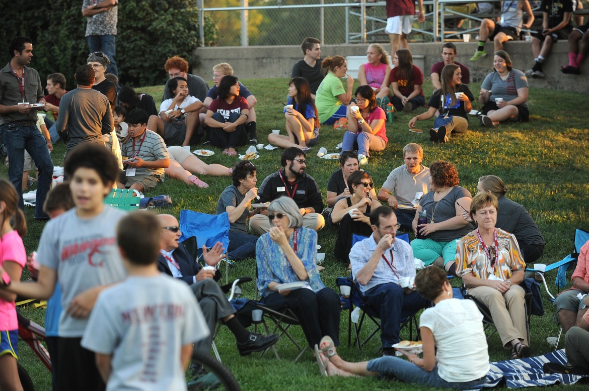 Hesston College students, alumni and friends enjoy a tapas meal on the lawn