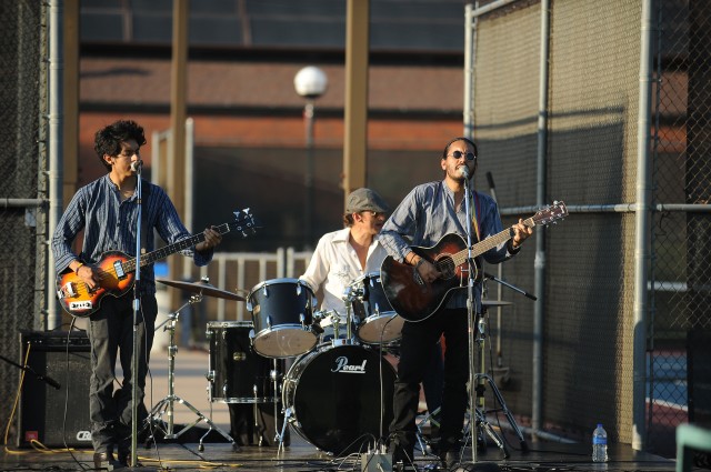 La Republica, a Latino rock band with member Daniel Moya (right), a 2008 graduate, performs on the entertainment stage during the Family Festival. Also pictured are Juan Moya (left) and David Guevara (center). The band is based out of Mexico City.