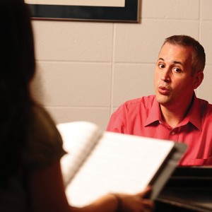 Matt Schloneger works with a Hesston College student during a private voice lesson.