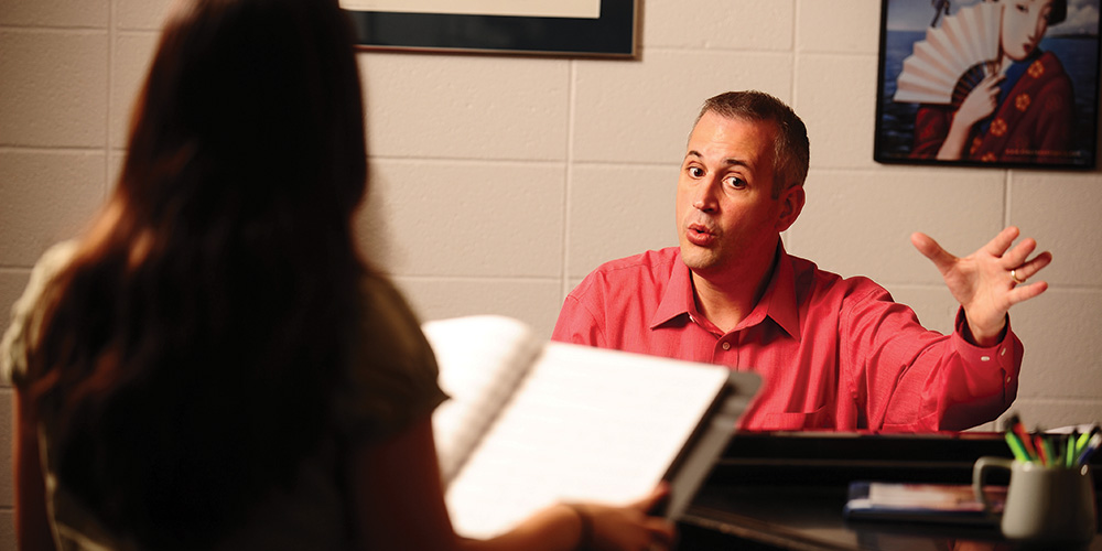 Matt Schloneger works with a Hesston College student during a private voice lesson.