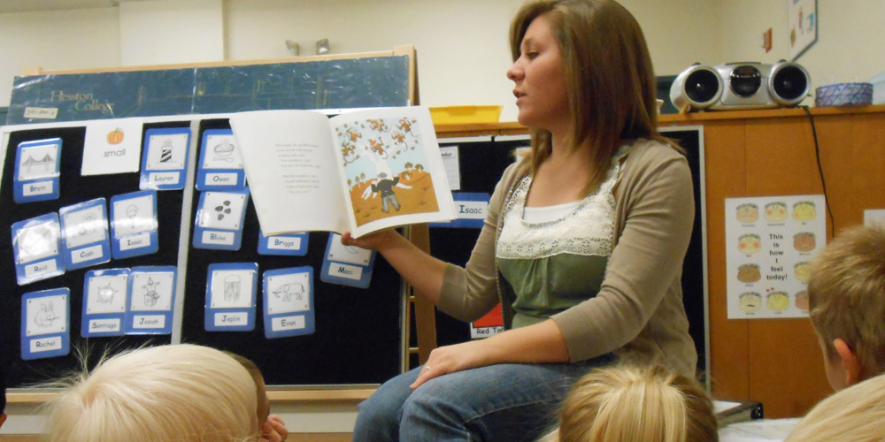 Morgan Martin reads to students at Hesston College Preschool