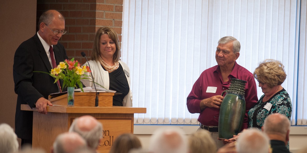 President Howard Keim ’72 and Interim Vice President of Advancement Tonya (Hunsberger) ’94 Detweiler present Doug ’62 and Connie Dorsing with a gift of appreciation for their $1 million gift to the college at the annual Partner Luncheon Sept. 27.