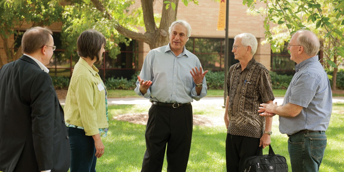 Sadi Othman (center) visits with Ken Rodgers, Margie Wiens, Dave Osborne and Ernst Wiens.