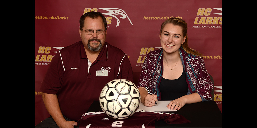 Adele Hofer signs to play soccer for Hesston College.