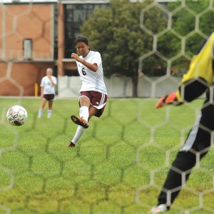 Machi Kanematsu scores a goal on a penalty kick for Hesston College.