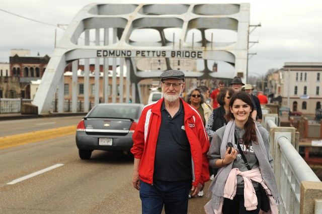 Former Hesston College Bible faculty member Marion Bontrager and freshman Irena Xhari cross the Edmund Pettus Bridge in Selma, Ala. 