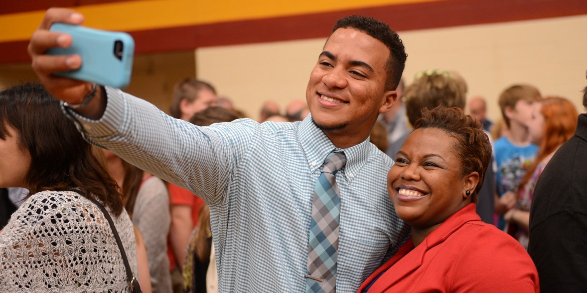 Graduate Lucas Garces Soliman (Santo Domino, Domincan Republic) takes a post-graduation selfie with biology instructor Marelby Mosquera.