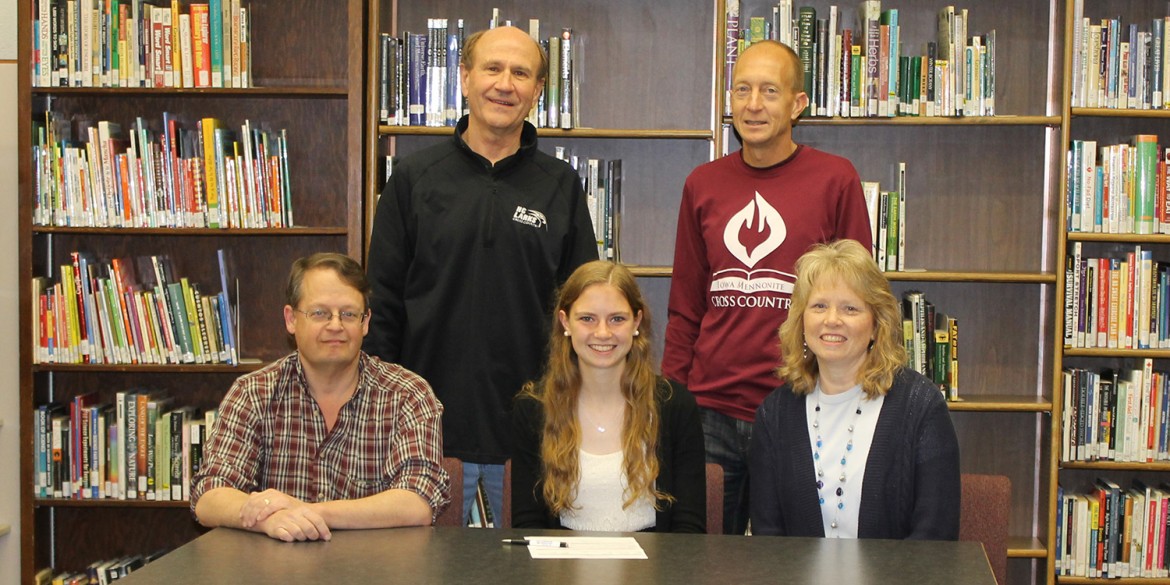 Renee Buckwalter signs a letter of intent to run cross country for Hesston College.