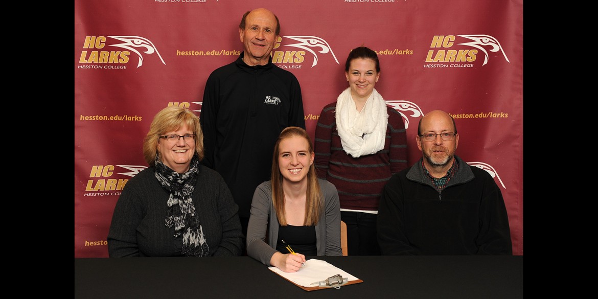 Emma Schrock signs a letter of intent to run cross country for Hesston College.