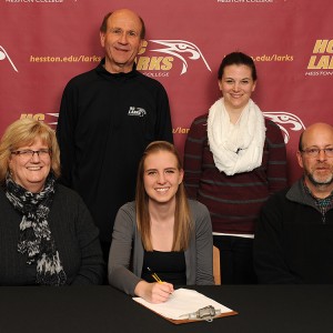 Emma Schrock signs a letter of intent to run cross country for Hesston College.