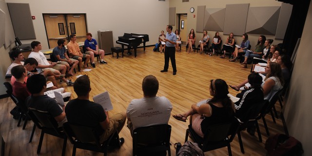 The Bel Canto Singers meet for the first time on the first day of classes, Aug. 17, with new music faculty member Russell Adrian (center) in the choral rehearsal space in the newly renovated Northlawn Center for Performing Arts Education.
