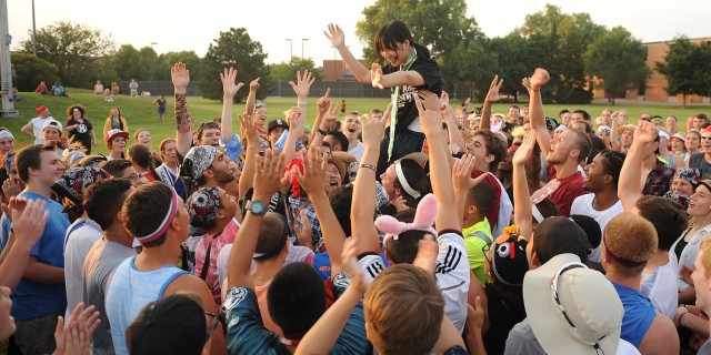 The winner of Rock, Paper, Scissors, Cheer is hoisted into the air following her victory at Mod Olympics.