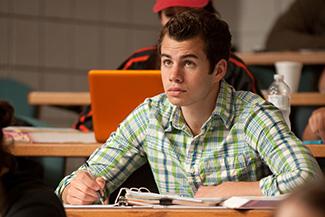 Greg Nolt ’13 (Partridge, Kan.) takes notes during a class lecture.