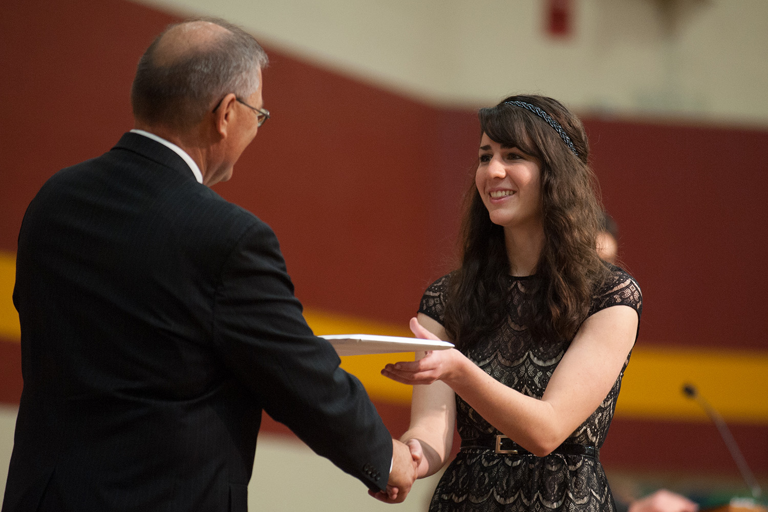 Elisabeth Wilder ’15 (Hesston, Kan.) recieves her diploma. President Howard Keim conferred 148 degrees for the class of 2015.