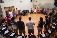 The Bel Canto Singers warm up on their first practice of the year in the Sauder Vocal Music Room.