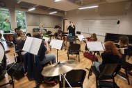 The Chamber Orchestra, under the direction of Rebecca Schloneger, rehearses in the Mabee Instrumental Music Room named in honor of the J.E. and L.E. Mabee Foundation of Tulsa, Okla.