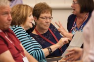 Members of the College Class of 1975 catch up with one another during Saturday afternoon class reunions.