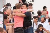 David Eigsti ’10 and Omar Reyes ’10 greet each other at the Friday evening family festival and tailgate picnic.