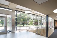 The front entry of the Northlawn Center for Performing Arts Education is an addition to the existing building, providing a welcoming entrance and access to the lower level. The glass front lets natural light into the building and offers an expansive view of campus.