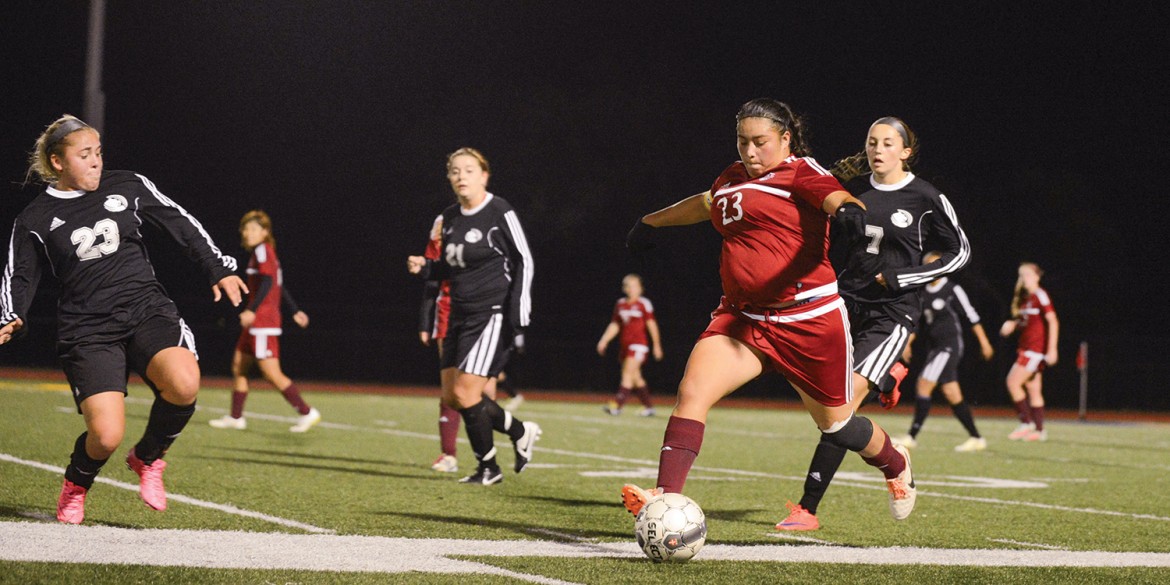 Enneliese Alcantar drives the ball up the left sideline in the playoff game vs. Butler County.