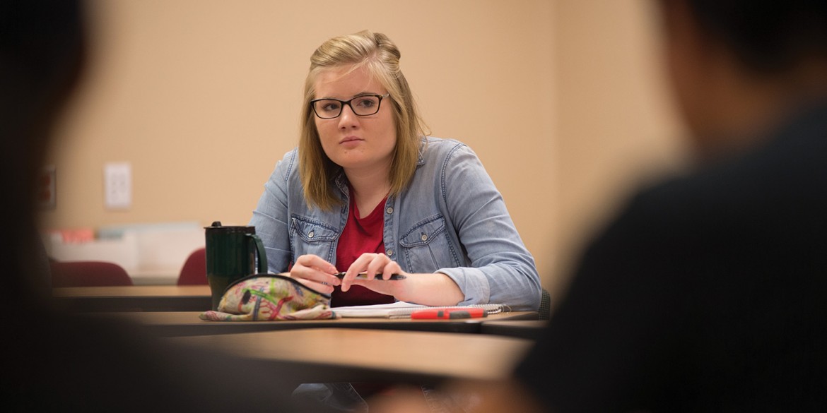 Rachael East watches a role play interaction during Exploring Ministry class.