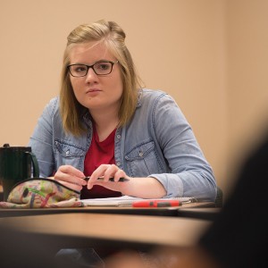 Rachael East watches a role play interaction during Exploring Ministry class.