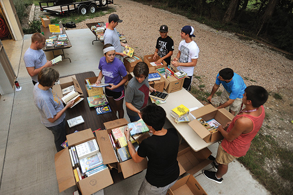 Students and staff sort and package books for Ethiopia Reads, a program that collaborates with communities in Ethiopia to build schools, plant libraries, train educators and boost literacy. 