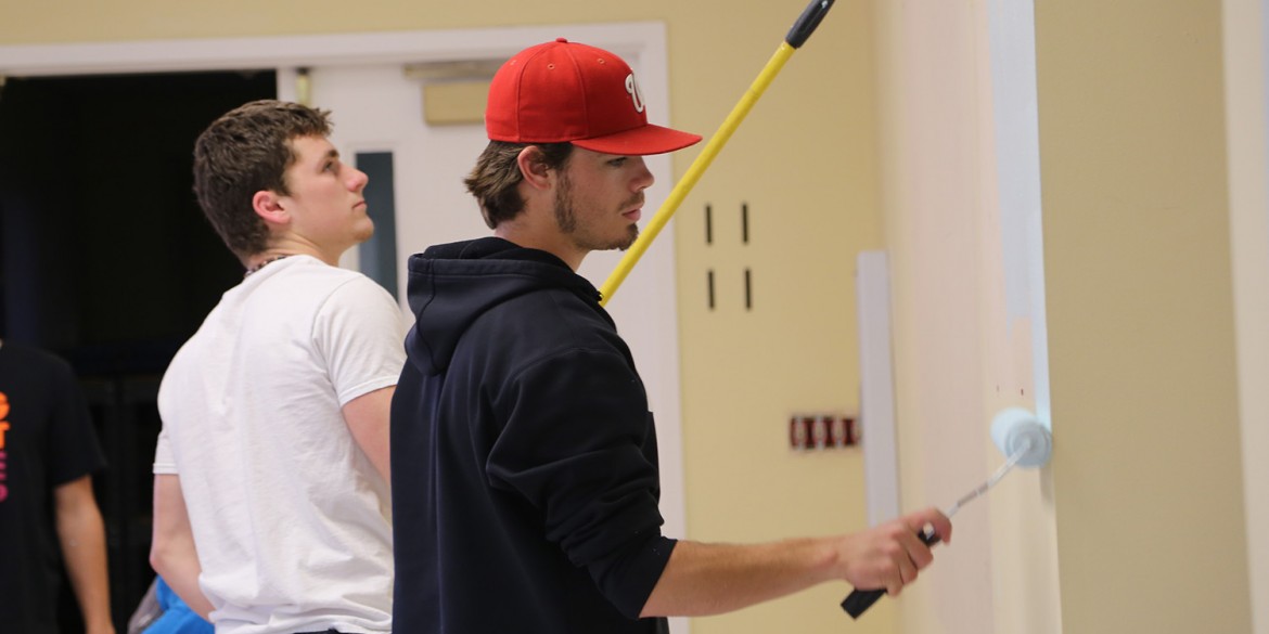 Students Weston Schroeder (Harper, Kan.) and Daulton Horton (Denton, Texas), paint at the Mennonite Central Committee Central States office (North Newton, Kan.) as part of their Larkfest service project. All on-campus students participated, with about 275 students at 35 service assignments.