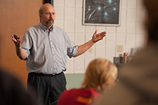 Nursing prof Gregg Schroeder lectures on the first day of BSN classes, fall 2015.