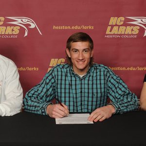 Curtis Oesch signs to play tennis for Hesston College.
