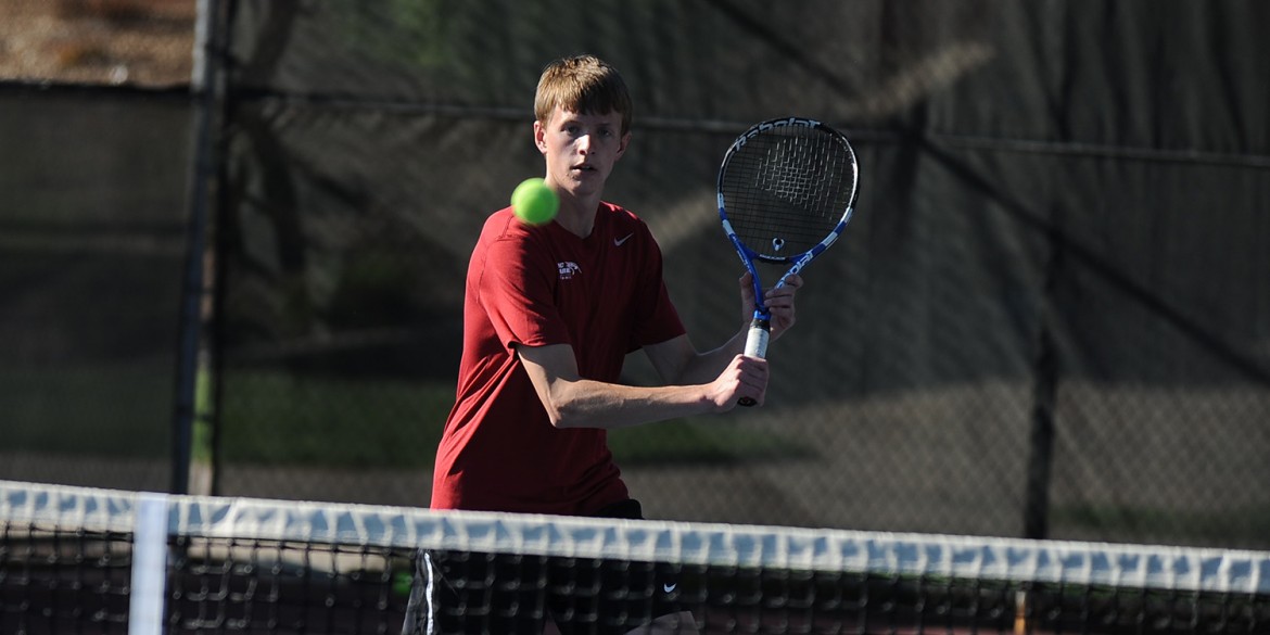 Hesston College men's tennis action photo - Riley Kingsley