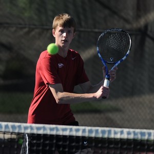 Hesston College men's tennis action photo - Riley Kingsley