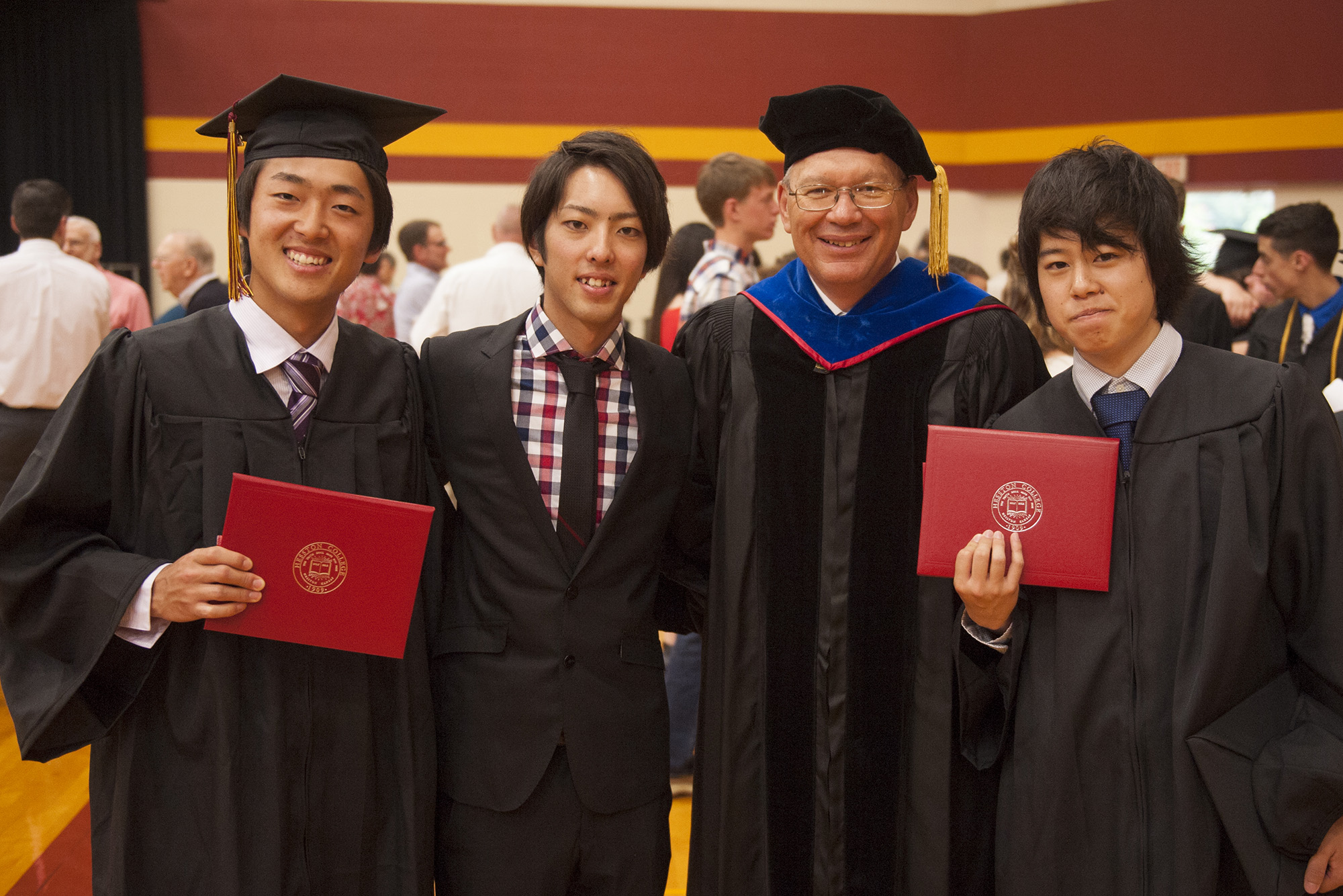 President Howard Keim ’72 celebrates with (from left) Yuki Torii ’16 (Nishio, Japan), Satoshi Hoshino ’16 (Saitama-ken, Japan) and Shimon Shike ’16 (Iwaki, Japan).