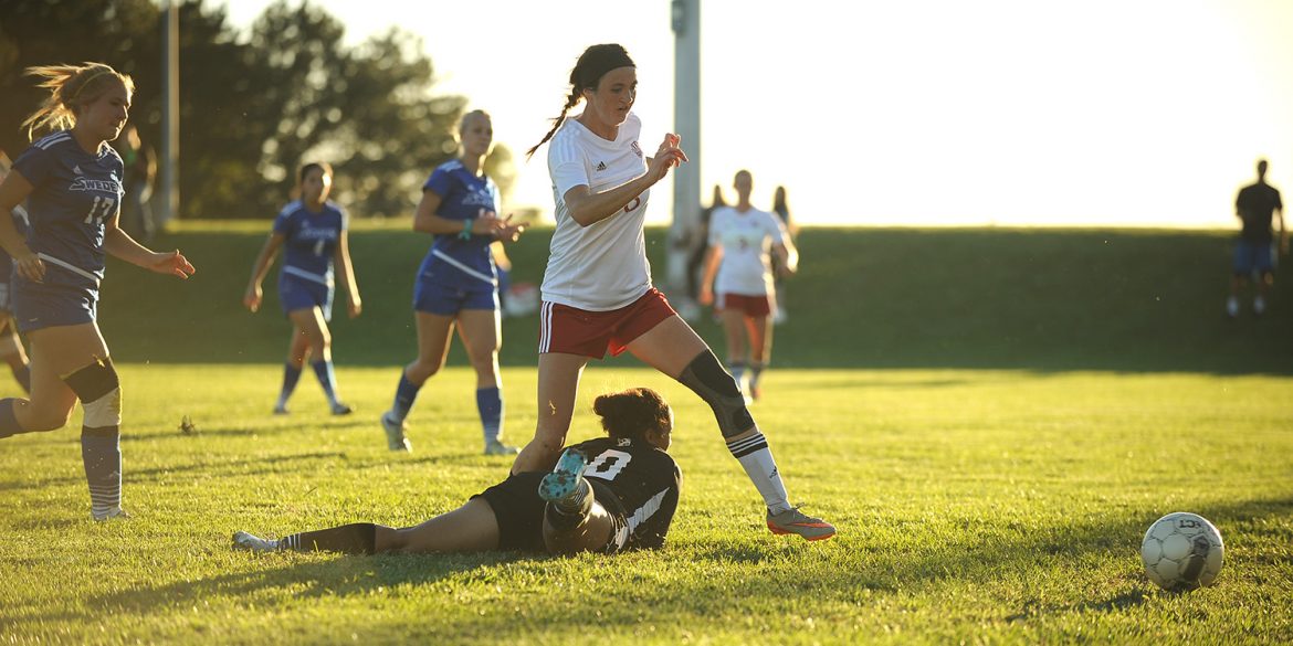 Hesston College women's soccer player Kenzie Johnson scores in a match with Bethany College JV