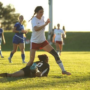 Hesston College women's soccer player Kenzie Johnson scores in a match with Bethany College JV